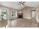 Bright living room features a vaulted ceiling, a stone fireplace, and durable wood-look floors at 3645 Kimber Ln, Sherrills Ford, NC 28673