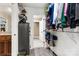Organized walk-in closet with shelving and a safe, conveniently located next to the bathroom at 3645 Kimber Ln, Sherrills Ford, NC 28673