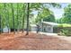 Green backyard featuring a spacious patio, mature trees, a shed, and a well-maintained lawn at 3708 Sweetgrass Ln, Charlotte, NC 28226