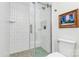Modern bathroom with a glass shower, white subway tile, and pebble floor at 3708 Sweetgrass Ln, Charlotte, NC 28226