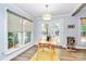 Cozy dining area with large windows and doors leading to the outside at 3708 Sweetgrass Ln, Charlotte, NC 28226