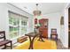 Bright dining room with a large window, stylish lighting, and classic wooden accents at 3708 Sweetgrass Ln, Charlotte, NC 28226