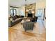Cozy living room with a stone fireplace, beamed ceilings, and large sectional sofa, perfect for relaxation at 3708 Sweetgrass Ln, Charlotte, NC 28226