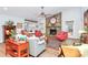 Open-concept living room with stone fireplace, light-colored walls and ample seating for entertaining at 3708 Sweetgrass Ln, Charlotte, NC 28226