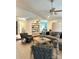 Bright living room with vaulted ceilings, stylish furnishings, decor and built-in shelving at 3708 Sweetgrass Ln, Charlotte, NC 28226