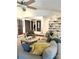 Comfortable living room with large sofa, ottoman and built-in shelving and plenty of natural light at 3708 Sweetgrass Ln, Charlotte, NC 28226
