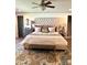 Luxurious main bedroom featuring a tufted headboard, wood floors, and stylish furnishings at 3708 Sweetgrass Ln, Charlotte, NC 28226
