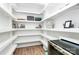 Spacious walk-in pantry with custom shelving and plenty of storage space at 3708 Sweetgrass Ln, Charlotte, NC 28226