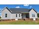 Home's backyard featuring a spacious, well-maintained lawn and a brick foundation at 3712 Travertine Dr, Lancaster, SC 29720