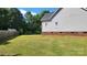 Large, grassy backyard with wood fence creating a secluded private yard at 3712 Travertine Dr, Lancaster, SC 29720