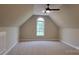 Spacious bonus room features a large window and carpet flooring at 3712 Travertine Dr, Lancaster, SC 29720