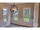 Dining room with hardwood floors, wainscoting, and bright lighting at 3712 Travertine Dr, Lancaster, SC 29720