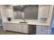 Kitchen with stainless steel appliances, white cabinets, and a view to the living area at 3712 Travertine Dr, Lancaster, SC 29720