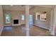 Bright living room featuring hardwood floors, a fireplace, and an open floor plan at 3712 Travertine Dr, Lancaster, SC 29720