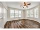 Bright bedroom with beautiful hardwood floors and bay windows offering a view of the lake at 3911 Sandy Point Dr, York, SC 29745