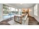 Dining room with a view, showcasing large windows, stylish table, and modern furnishings at 3911 Sandy Point Dr, York, SC 29745