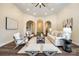 Open-concept living room featuring elegant archways and neutral decor for a welcoming atmosphere at 3911 Sandy Point Dr, York, SC 29745
