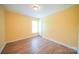 Bedroom features hardwood floors, bright walls, natural light, and is ideal for creating a comfortable living space at 4037 Lakota Ct, Charlotte, NC 28269