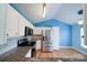 Bright kitchen featuring stainless steel appliances, granite counters, and light wood flooring at 4037 Lakota Ct, Charlotte, NC 28269