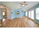 Open concept living room with view of the kitchen and access to the patio through sliding doors at 4037 Lakota Ct, Charlotte, NC 28269