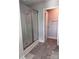 Bathroom featuring a glass-enclosed shower and modern tile flooring at 4041 Port Richmond Ave # 9, Gastonia, NC 28056