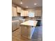 Kitchen featuring white cabinets, gray backsplash, and island with seating at 4041 Port Richmond Ave # 9, Gastonia, NC 28056