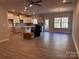 Open concept kitchen with white cabinets and stainless steel appliances at 4041 Port Richmond Ave # 9, Gastonia, NC 28056