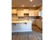 Bright kitchen features white cabinets, a gray backsplash, stainless steel sink, and a large island at 4041 Port Richmond Ave # 9, Gastonia, NC 28056