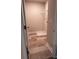 A small laundry room has tile floors and a white shelf and contains connections for a washer and dryer at 4041 Port Richmond Ave # 9, Gastonia, NC 28056