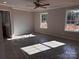 Main bedroom with neutral walls, a ceiling fan, and two large windows with a wooded view at 4041 Port Richmond Ave # 9, Gastonia, NC 28056