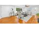 Bright living room featuring hardwood floors, neutral decor, and ample natural light at 4114 Stacy Blvd, Charlotte, NC 28209