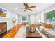 Spacious living room featuring hardwood floors, a fireplace, and ample seating at 4114 Stacy Blvd, Charlotte, NC 28209