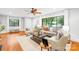 Light-filled living room with hardwood floors and comfortable seating arrangement at 4114 Stacy Blvd, Charlotte, NC 28209