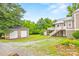 Large backyard with a detached garage and shed, offering ample storage and outdoor space at 4569 Edgeland Rd, Edgemoor, SC 29712