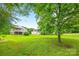 Expansive, lush backyard with mature trees and ample green space, perfect for outdoor activities at 4569 Edgeland Rd, Edgemoor, SC 29712