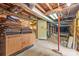 Unfinished basement space with exposed brick and ductwork, ready for customization and storage at 4569 Edgeland Rd, Edgemoor, SC 29712
