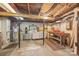 Bright basement area with workbench, water heater and lighting, ideal for a workshop at 4569 Edgeland Rd, Edgemoor, SC 29712