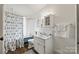 Bright bathroom features blue painted bathtub, patterned shower curtain, and ample lighting at 4569 Edgeland Rd, Edgemoor, SC 29712
