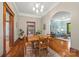 Charming dining area with hardwood floors, wooden table, and views of the living room creates a cozy gathering space at 4569 Edgeland Rd, Edgemoor, SC 29712