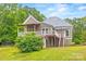Charming home with a metal roof and a spacious back deck, surrounded by lush greenery at 4569 Edgeland Rd, Edgemoor, SC 29712