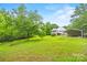 Beautiful home surrounded by mature trees and a lush green lawn with rear carport at 4569 Edgeland Rd, Edgemoor, SC 29712