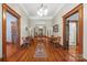 Long hallway with hardwood floors, decorative archway, and view of multiple rooms creates a grand entrance at 4569 Edgeland Rd, Edgemoor, SC 29712
