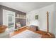 Cozy hallway featuring hardwood floors and neutral wall colors, creating a warm and welcoming transition space at 4569 Edgeland Rd, Edgemoor, SC 29712