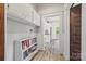 Hallway with built-in shelving and doorway views to other rooms at 4569 Edgeland Rd, Edgemoor, SC 29712