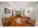 Open hallway features hardwood floors, wooden trim, and natural light, creating a warm and inviting space at 4569 Edgeland Rd, Edgemoor, SC 29712