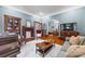 Inviting living room with hardwood floors, built-in bookcase, and cozy seating for relaxation and entertainment at 4569 Edgeland Rd, Edgemoor, SC 29712