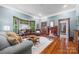 Comfortable living room featuring hardwood floors, bay window, and fireplace, perfect for relaxing and entertaining at 4569 Edgeland Rd, Edgemoor, SC 29712