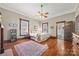 Spacious main bedroom with hardwood floors, a ceiling fan, and natural light at 4569 Edgeland Rd, Edgemoor, SC 29712
