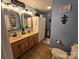 Bathroom with a double sink vanity and ample storage space, perfect for a busy household at 490 Deberry Rd, Mount Gilead, NC 27306