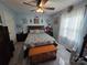 This bedroom features light blue walls and coordinating bedding, complete with a wooden chest at the foot of the bed at 490 Deberry Rd, Mount Gilead, NC 27306